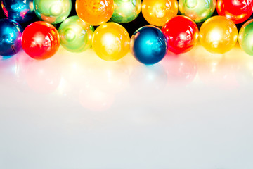 multi-colored Christmas light bulbs on white background