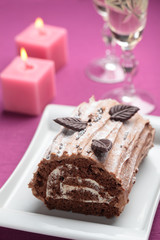 Yule log cake on a Christmas table