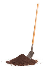 Vertical shot of shovel stuck in a pile of dirt