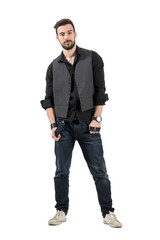 Young male fashion model holding his suspenders isolated