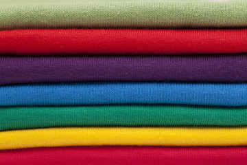 A stack of shirts in bright colours