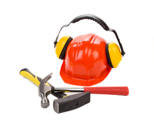 Ear muffs on hard hat and hammer.