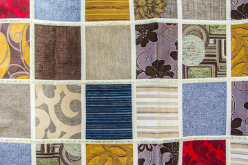 background texture of a patchwork of different pieces of fabric