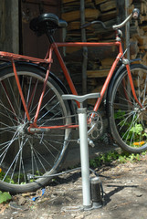 Fototapeta na wymiar pump and red bicycle