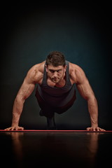 Fototapeta na wymiar athletic young man exercising