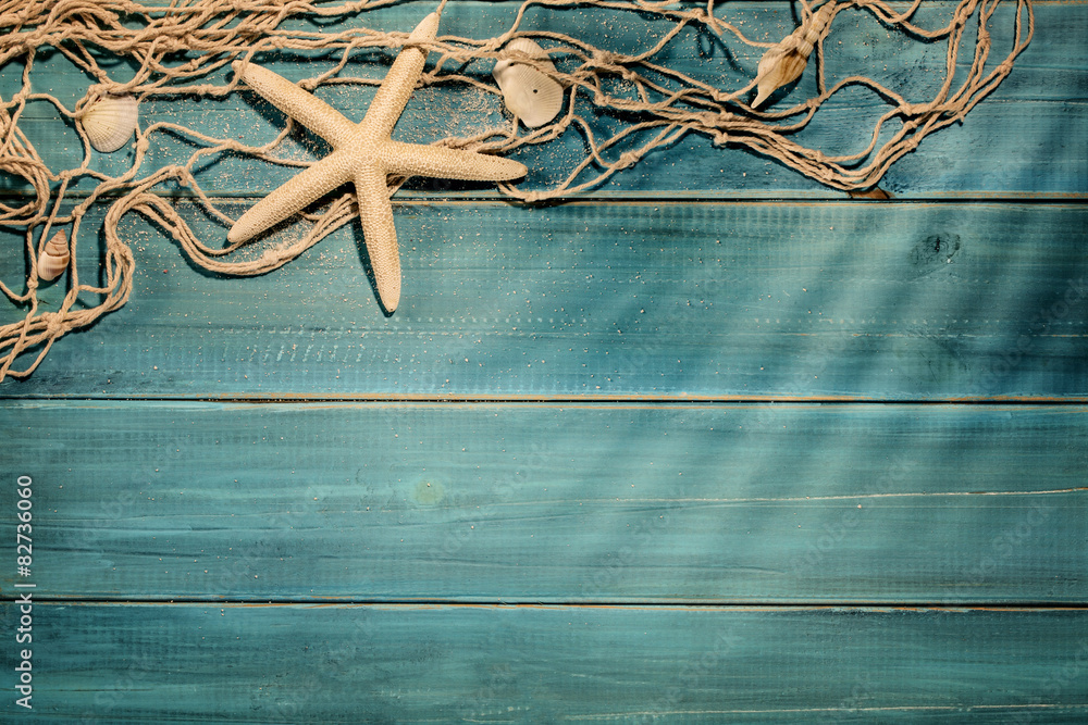 Wall mural aged deck with fish net and seashells