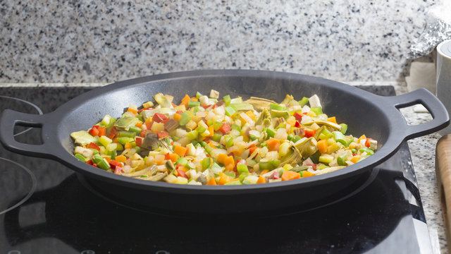 Cooking Mediterranean vegetables on a pan