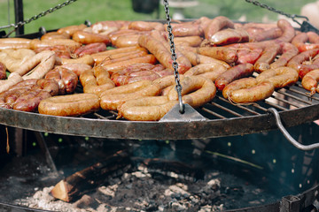 Cooking wienerwurst on a barbecue grill