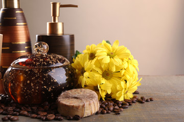 Composition of spa treatment on wooden table, on light color background