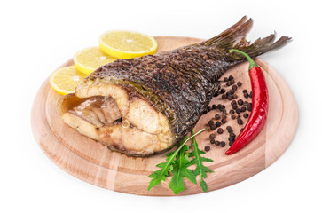 Grilled carp with lemon