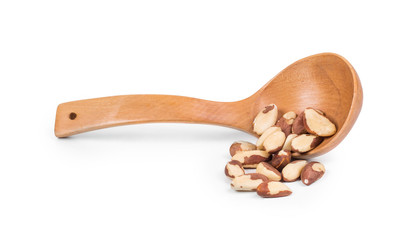 Wooden spoon with brazil nuts. 
