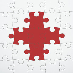 Fototapeta premium Puzzle pieces with red cross