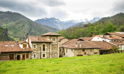 Fototapeta na wymiar Mogrovejo Village in front of the Picos de Europa, Cantabria, Sp