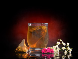 hot tea splashing in the glass