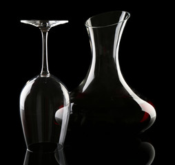 Glass carafe of wine on dark background