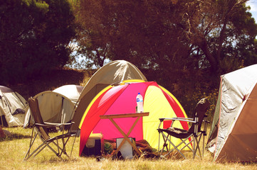 Group of tents with chairs and table
