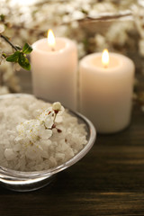 Spa still life with flowering branches on wooden table, closeup