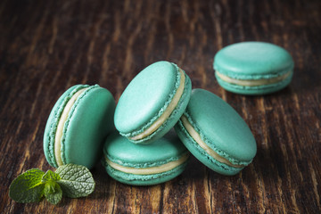 mint macaroon on a wooden surface