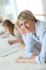Portrait of smiling teacher in classroom