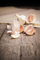 Organic garlic on rustic old wooden table