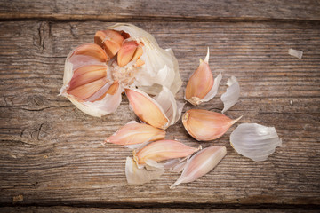 Organic garlic on rustic old wooden table