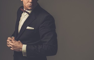 Sharp dressed fashionist wearing jacket and bow tie