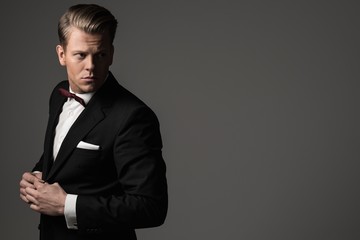 Sharp dressed fashionist wearing jacket and bow tie