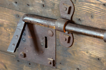 old lock with big deadbolt to close the door of the castle
