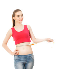 beautiful slender girl measures the waist  isolated in white bac