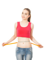 beautiful slender girl measures the waist  isolated in white bac