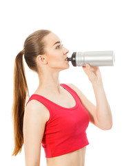 athletic girl drinks water after exercising isolated in white ba