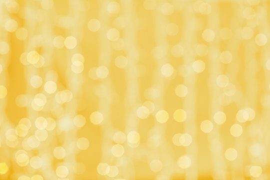 blurred golden background with bokeh lights