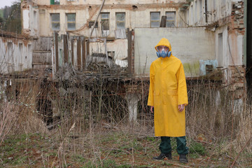 Man with protective  mask and protective clothes explores danger