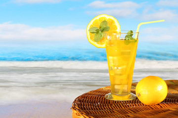 Summer drink with blur beach on background