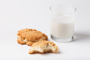Cookies with cottage cheese - sochnik and glass of milk on a lig