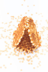 Wafer and pastry decoration stars on a light background. Selecti
