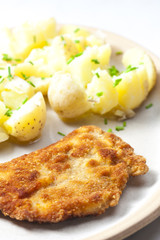 fried pork fillet with boiled unpeeled potatoes