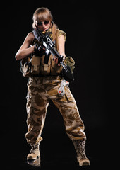 Fototapeta na wymiar Beautiful army girl with gun