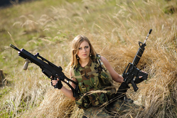 Fototapeta premium Beautiful army girl with guns