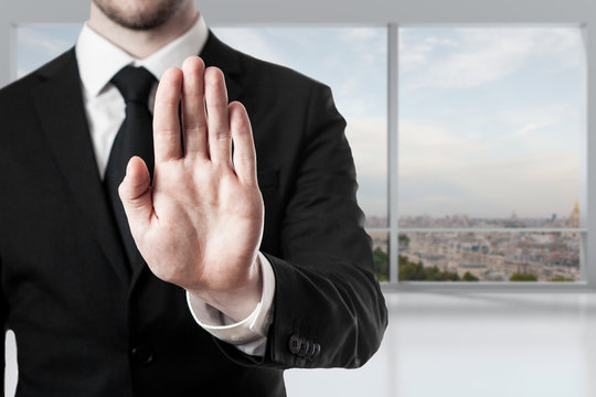 businessman in office hand stop gesture