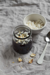 chocolate pudding with meringue crumbs and walnuts