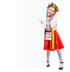 girl in  Ukrainian  costume behind white board 