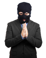 corruption concept : man in business suit and black mask 