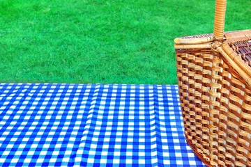 Wall murals Picnic Picnic Basket On The Table With Blue White Tablecloth