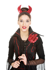 Woman in devil carnival costume. 