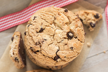 Pile of chocolate cookies with a glass of milk