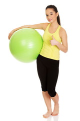 Young woman with pilates ball.
