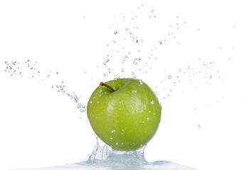 Fresh apple in water splash on white background