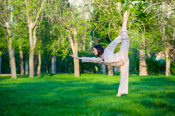 Practicing yoga in the morning, with trees  background