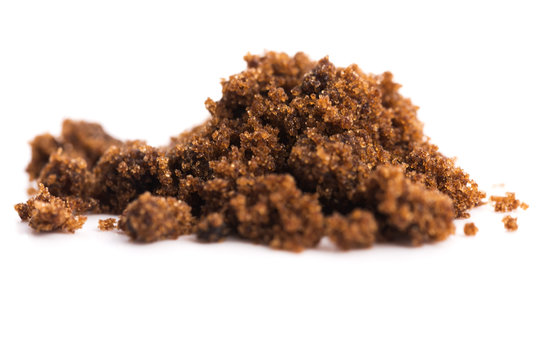 brown muscovado sugar isolated on a white background